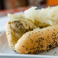 Beer Bratwurst · Old World style brat cooked in beer & onions and grill finished. Dressed with grilled onions...
