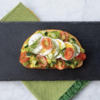 Egg Avocado Toast · Sourdough bread topped with lightly mashed and seasoned avocado, organic grape tomatoes, cuc...