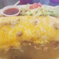 Breakfast Burrito · Potatoes and eggs wrapped in a flour tortilla, smothered with green chile and topped with ch...