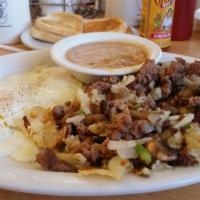 Machaca · Two eggs and seasoned ground beef mixed with onions, green peppers, mushrooms, and hash brow...