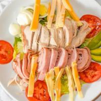 Chef Salad · Strips of ham and turkey, American and Swiss cheese, with tomatoes, and Egg over tossed gree...
