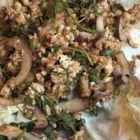 Larb Gai / ลาบไก · Gluten free. Ground chicken, rice powder, onion, cilantro, mint, and lime juice.