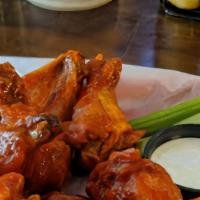 House Wings · Ten jumbo wings tossed with your choice of traditional Buffalo hot sauce, honey Sriracha sau...