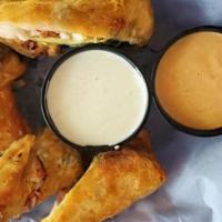 31 East Avocado Rolls · House-made eggrolls filled with chicken, bacon, black beans, avocado, tomato, and cheddar ja...