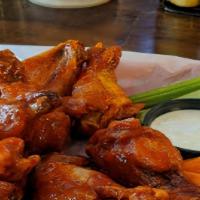 House Wings-1/2 Order · Ten jumbo wings tossed with your choice of traditional Buffalo hot sauce, honey Sriracha sau...
