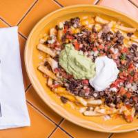 Super Nacho Fries · French fries with refried beans, our pico de gallo, Monterey jack cheese topped with guacamo...