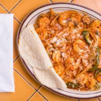 Arroz Con Camarones · Shrimp on a bed of rice prepared with bell peppers onion mushrooms red sauce topped with mel...