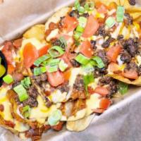 Ale House Nachos · House potato chips, Monterey Jack & cheddar cheese, tomato, green onions, ale house chili, g...