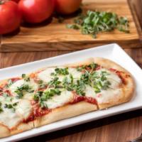 Margherita Flatbread · Fresh micro basil, light tomato sauce, parmesan & mozzarella cheese.