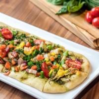 Vegetable Pesto Flatbread · Cherry tomato, artichoke, broccolini, rainbow carrots, pesto.