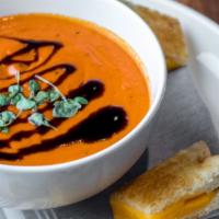 Slow-Roasted Tomato Soup · Finished with balsamic, micro basil.. Served with grilled cheese bites.