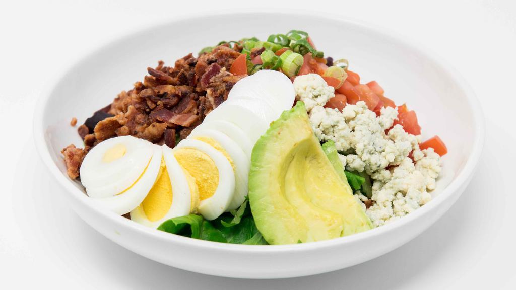 Brewery Cobb Salad · Chopped greens, crispy bacon, grilled chicken, hard-boiled eggs, tomatoes, avocado, crumbled blue cheese, blue cheese dressing