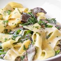 Alfredo Pappardelle Pasta · Pappardelle pasta. alfredo sauce, broccolini, portobello.. Add chicken or shrimp for $6