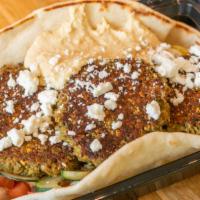 The Franklin · Falafel, Choice of Greens, Onions, Cucumbers,  Tomatoes, Choice of Hummus or Tzatziki