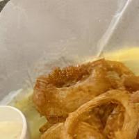 Onion Ring Around The Rosie · Huge serving of beer-battered and baked (like our kitchen staff) rings, served with apocalyp...