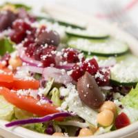 Greek Salad · Mixed fresh greens, onion, tomato, cucumber, chick peas, beets, olives & feta cheese. Gluten...
