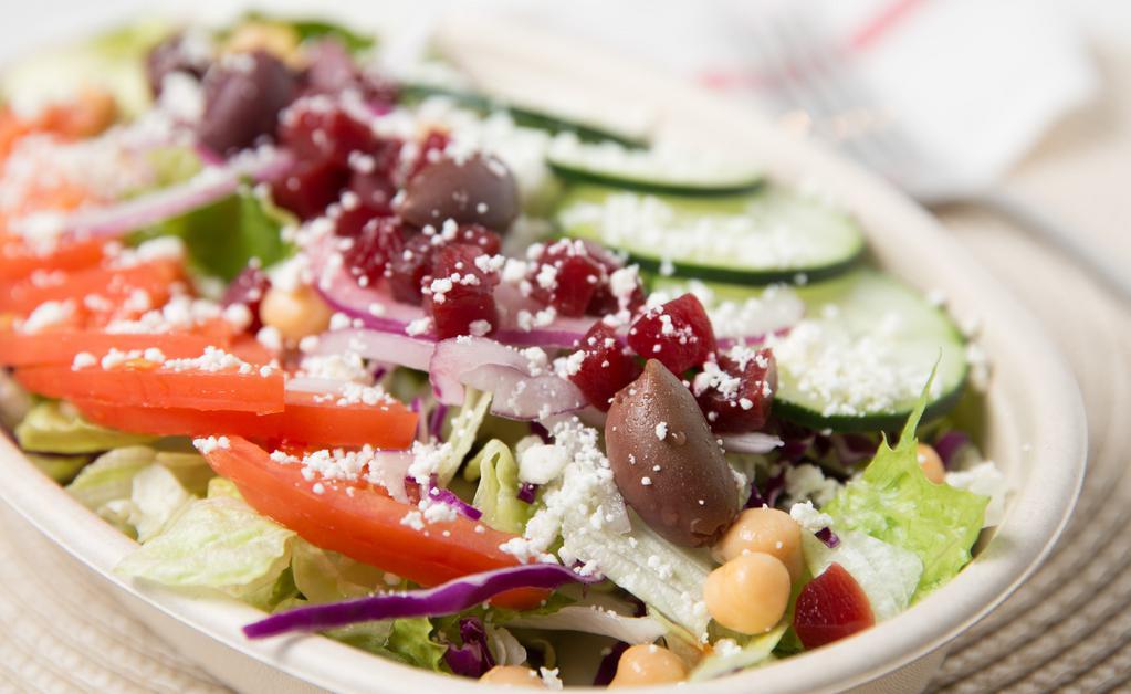 Greek Salad · Mixed fresh greens, onion, tomato, cucumber, chick peas, beets, olives & feta cheese. Gluten Free