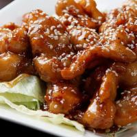 Sesame Chicken 芝麻鸡 · Boneless crispy chicken breast meat with special sauce topped with sesame seeds.
