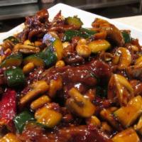 Kung Pao Beef 宫爆牛 · Sliced tender beef sauteed in spicy sauce and topped with peanuts.