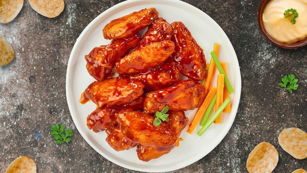 Bully Buffalo Chicken Wings · Breaded or naked fresh chicken wings, fried until golden brown, and tossed in buffalo sauce. Served with a side of ranch or bleu cheese.
