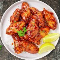 Honey Glazed Wings · Breaded or naked fresh chicken wings, fried until golden brown, and tossed in honey & hot sa...