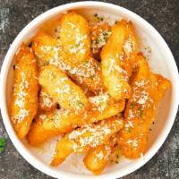 Boolean Garlic Parmesan Boneless Wings · Boneless breaded fresh chicken wings, fried until golden brown, and tossed in garlic and par...