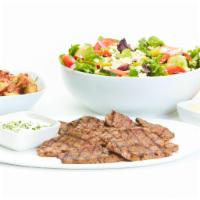 Grilled Lamb Feast For 4 · Sliced grilled lamb that includes a choice of salad with dressing, choice of side, and choic...