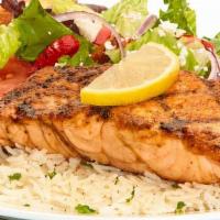 Grilled Salmon Feast · Atlantic salmon, seasoned, and chargrilled. Served with Greek salad and your choice of roast...