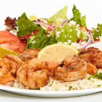 Grilled Shrimp Feast · Seasoned and grilled with lemon juice, butter, and blackened seasoning. Served with Greek sa...
