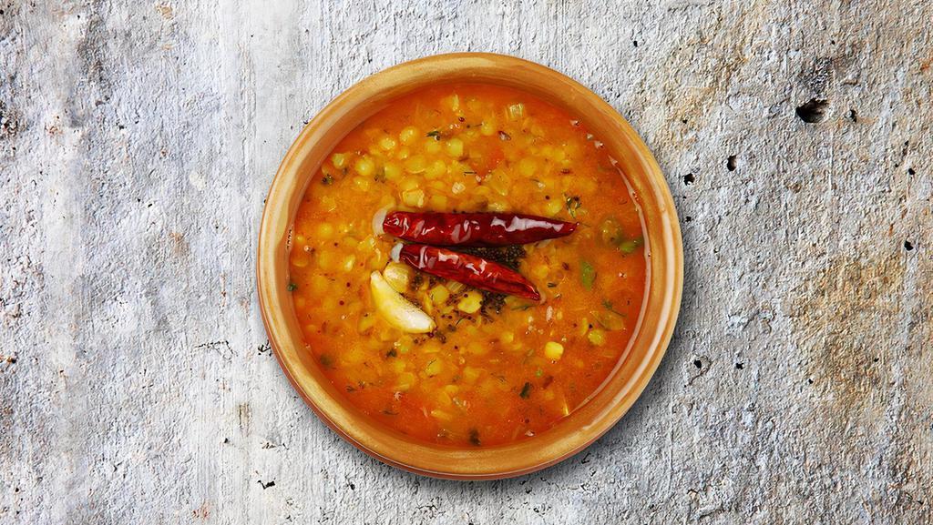 Liberty Lentil · Fried Yellow dal cooked on low flame with garlic, dry red chili, and cumin seeds.