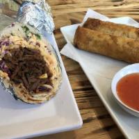 Flaming Boar · Spicy grilled Korean pork burrito. Rice, fresh cabbage mix, and pickled daikon. Topped with ...