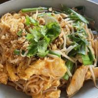 Pad Thai · Rice noodles + bean sprouts + scallions + eggs + peanuts + cilantro + lime wedge.