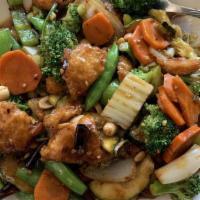 Kung Pao · Spicy. Bell Peppers + onions + zucchini + carrots + roasted peanuts + garlic + red whole chi...