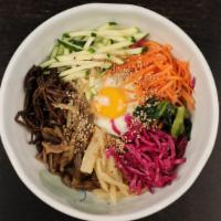 San Chae Bibimbop · An assortment of mountain grown, root based vegetables served over steamed rice with a fried...