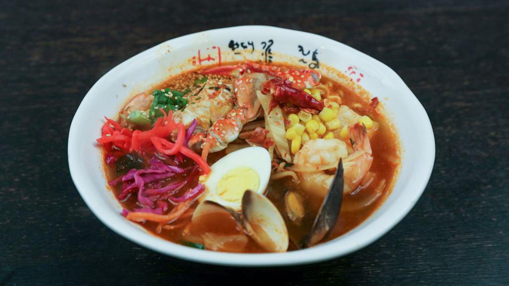 Spicy Seafood Ramen · Medley of clams, mussels, squid, a jumbo shrimp and crab in a spicy seafood broth