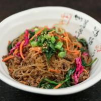 Jap-Chae (Large) · Stir-fried sweet potato glass noodles mixed with spinach, squash, carrots, red cabbage and o...