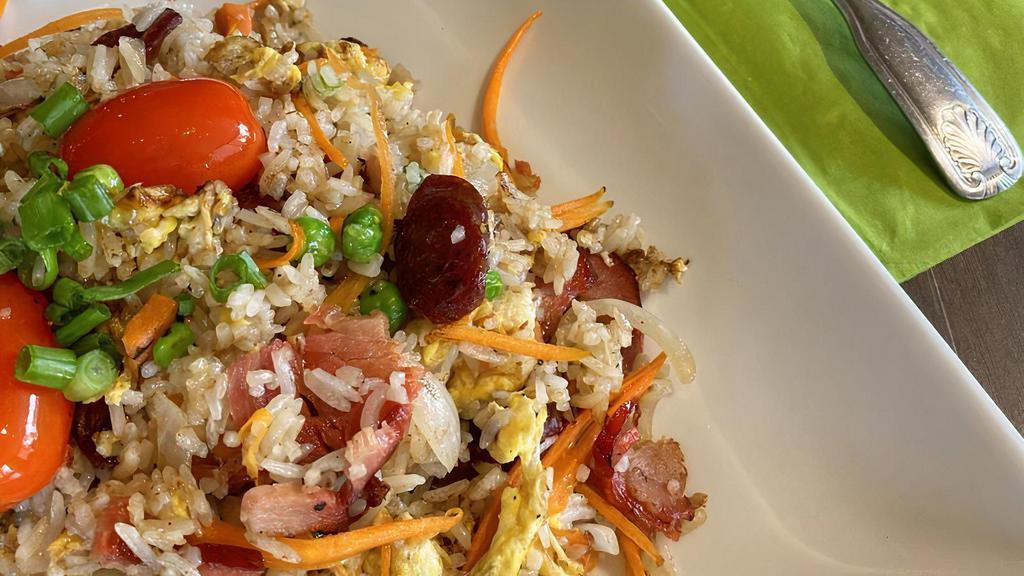 Nar'S Fried Rice · Rice stir-fried with BBQ pork, Chinese sausage, peas, carrots and onions.