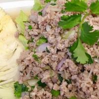 Larb · Ground (chicken, beef or pork) tossed with crispy roasted rice, onion, cilantro, lime juice ...