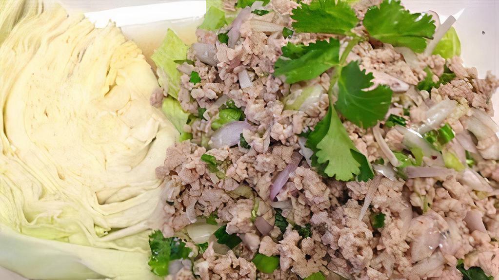 Larb · Ground (chicken, beef or pork) tossed with crispy roasted rice, onion, cilantro, lime juice served with lettuce
