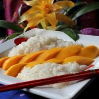 Mango Sticky Rice ( Seasonal) · Mango and sticky rice topped with coconut milk.