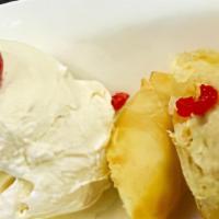 Banana Roll · Deep fried banana wrapped with shredded coconut served with vanilla ice cream.