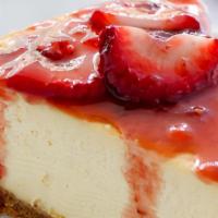 Ny Cheesecake W/ Strawberries · Holy Cheeseus! This is good! Authentic style, creamy Slice of NY Cheesecake. Strawberries re...