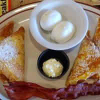 2 Squared Breakfast · Two pieces of our custard dipped French toast, two eggs any style with two strips of bacon.