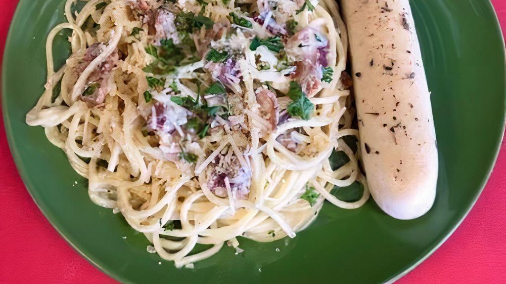Bacon Carbonara · Piping hot spaghetti tossed in a parmesan, garlic cream sauce mixed with fresh cooked bacon.