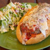 Meatball Sub · Great old fashion Italian meatball sub. Homemade meatballs and Italian red sauce. Topped wit...