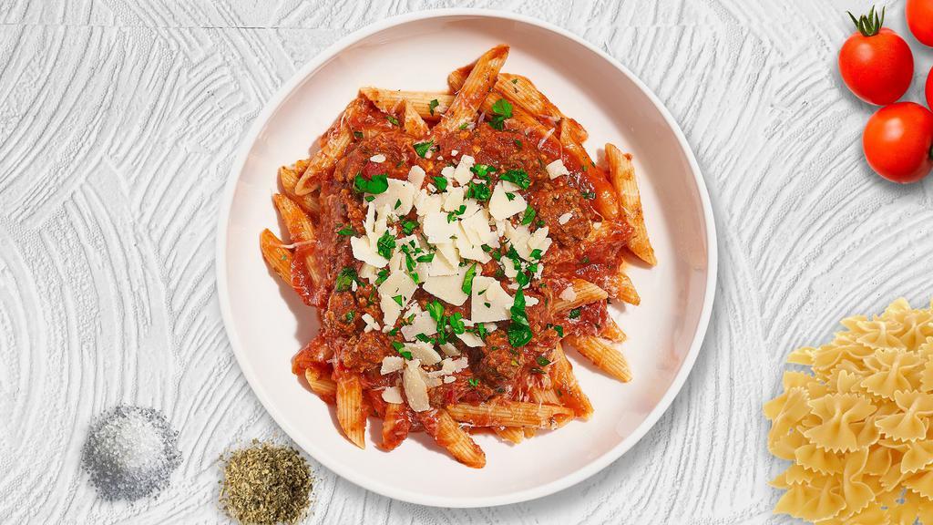 Penne And Vegan Ground Breaking Beef · Fresh penne pasta served with a plant-based meaty red sauce and your choice of toppings.