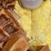 Churro Waffle · our Belgian waffle tossed in churro dust, maple syrup & two free range *eggs.