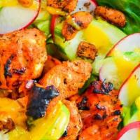 Fire-Grilled Chicken Breast Tikka Salad · Fire-roasted boneless chicken breast (white meat ) served over salad.