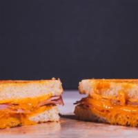 The Ham & Cheese · Melted American cheese and ham between two slices of buttery grilled bread.