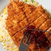 Katsu Chicken · Japanese-style Chicken over egg fried rice topped with teriyaki sauce, peas, carrots, onions...